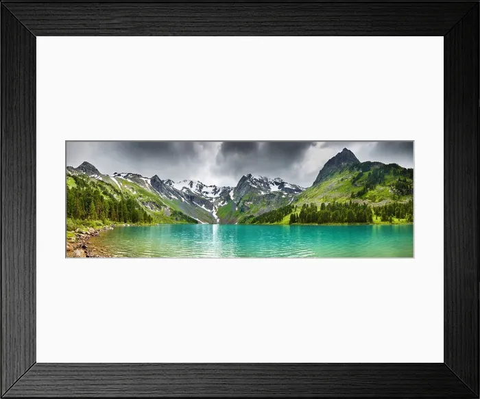 Framed Print : Mountain landscape with turquoise lake and cloudy sky Framed Print : Mountain landscape with turquoise lake and cloudy sky