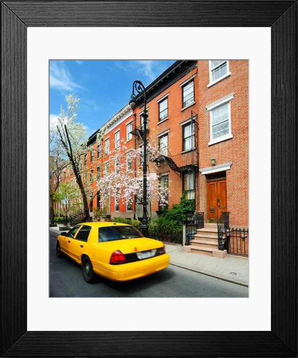 Framed Print : Yellowcab passes by Greenwich Village apartments in New York City Framed Print : Yellowcab passes by Greenwich Village apartments in New York City