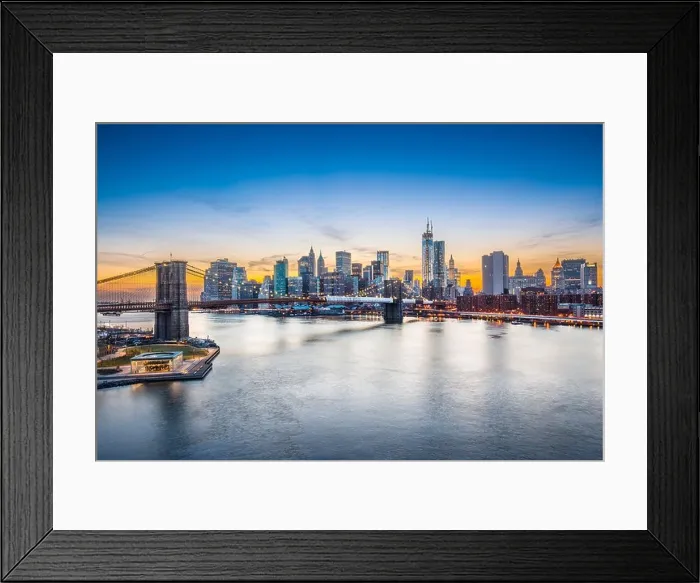 Framed Print : Famous view of New York City over the East River towards the financial district in the borough of Manhattan Framed Print : Famous view of New York City over the East River towards the financial district in the borough of Manhattan
