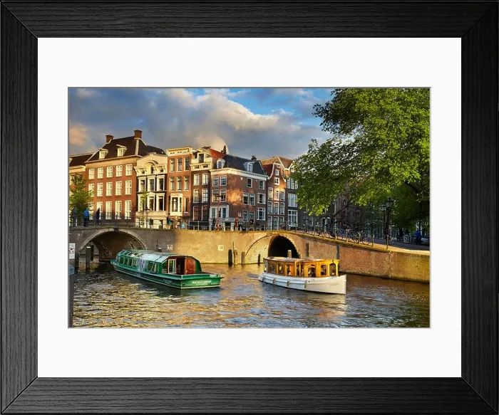 Framed Print : Tourist boat at Amsterdam bridge canal - Holland, Netherlands Framed Print : Tourist boat at Amsterdam bridge canal - Holland, Netherlands