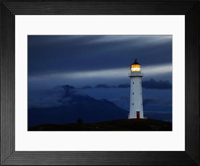 Framed Print : Cape Egmont Lighthouse and Taranaki Mount on background, New Zealand Framed Print : Cape Egmont Lighthouse and Taranaki Mount on background, New Zealand