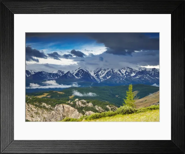 Framed Print : Landscape with snowy mountains and cloudy sky Framed Print : Landscape with snowy mountains and cloudy sky