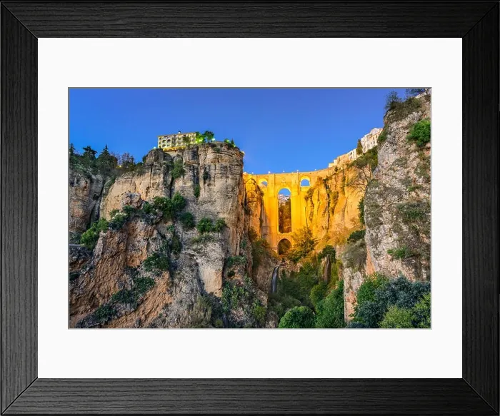 Framed Print : Ronda, Spain at Puente Nuevo Bridge at dusk Framed Print : Ronda, Spain at Puente Nuevo Bridge at dusk