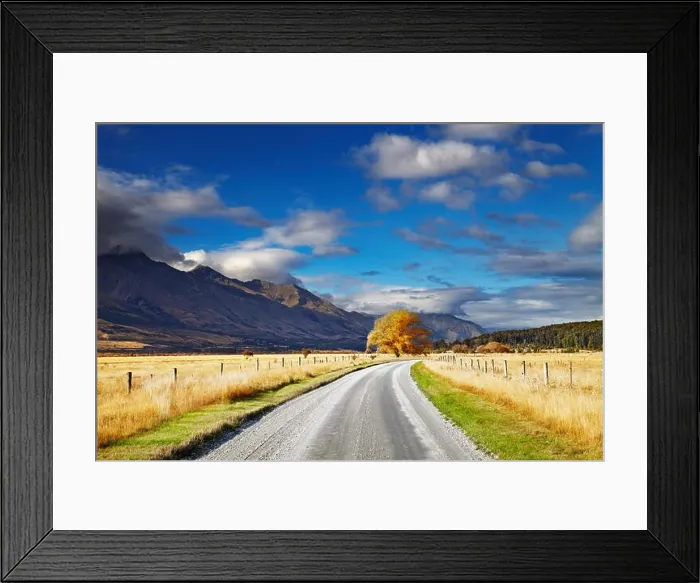 Framed Print : Mountain landscape with road and blue sky, Otago, New Zealand Framed Print : Mountain landscape with road and blue sky, Otago, New Zealand