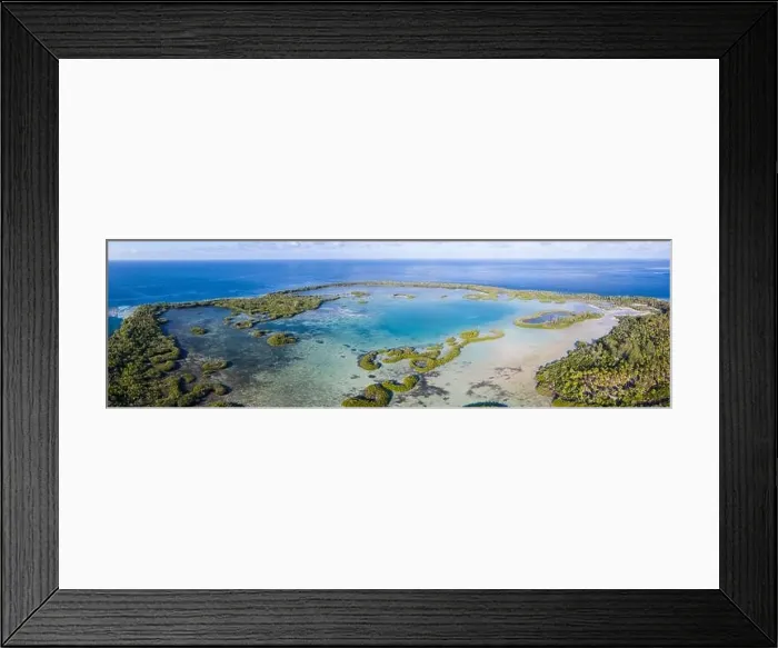 Framed Print : A remote tropical island in the Molucca Sea is fringed by mangrove forest surrounding a shallow lagoon. This island sits amid the Coral Triangle Framed Print : A remote tropical island in the Molucca Sea is fringed by mangrove forest surrounding a shallow lagoon. This island sits amid the Coral Triangle