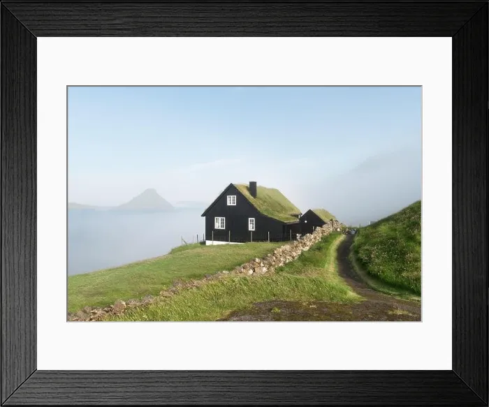 Framed Print : Foggy morning view of a house with typical turf-top grass roof in the Velbastadur village on Streymoy island, Faroe islands, Denmark Framed Print : Foggy morning view of a house with typical turf-top grass roof in the Velbastadur village on Streymoy island, Faroe islands, Denmark