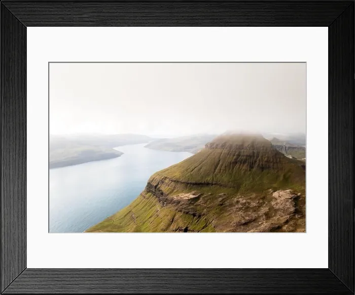 Framed Print : Foggy mountain peaks and clouds covering sea and mountains. Panoramical view from famous place - Sornfelli on Streymoy island, Faroe islands Framed Print : Foggy mountain peaks and clouds covering sea and mountains. Panoramical view from famous place - Sornfelli on Streymoy island, Faroe islands