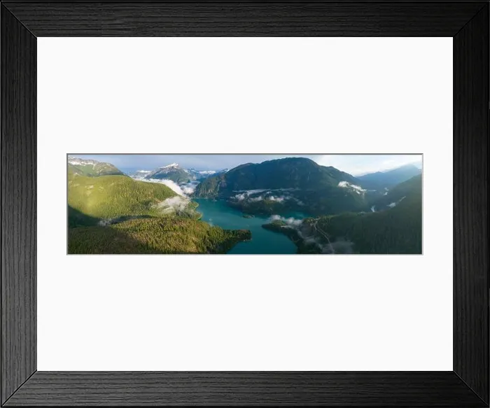 Framed Print : Rugged, forest-covered landscape surrounds Diablo Lake in North Cascades National Park. This mountainous region in Washington is absolutely beautiful Framed Print : Rugged, forest-covered landscape surrounds Diablo Lake in North Cascades National Park. This mountainous region in Washington is absolutely beautiful