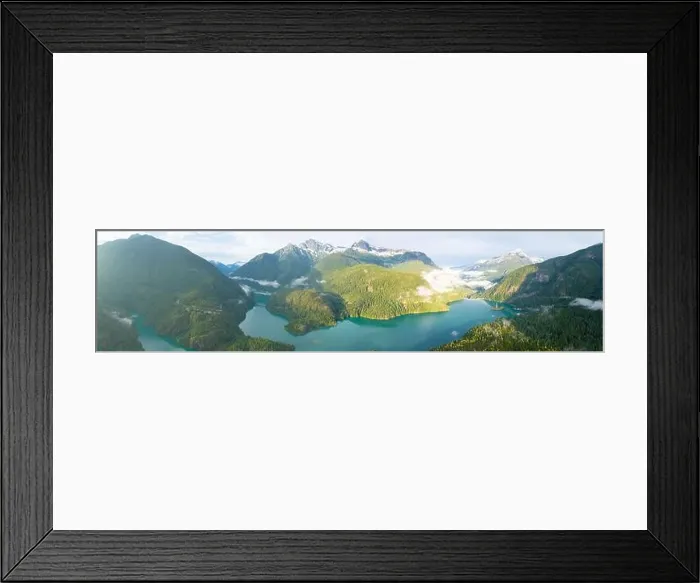 Framed Print : Rugged, forest-covered landscape surrounds Diablo Lake in North Cascades National Park. This mountainous region in Washington is absolutely beautiful Framed Print : Rugged, forest-covered landscape surrounds Diablo Lake in North Cascades National Park. This mountainous region in Washington is absolutely beautiful