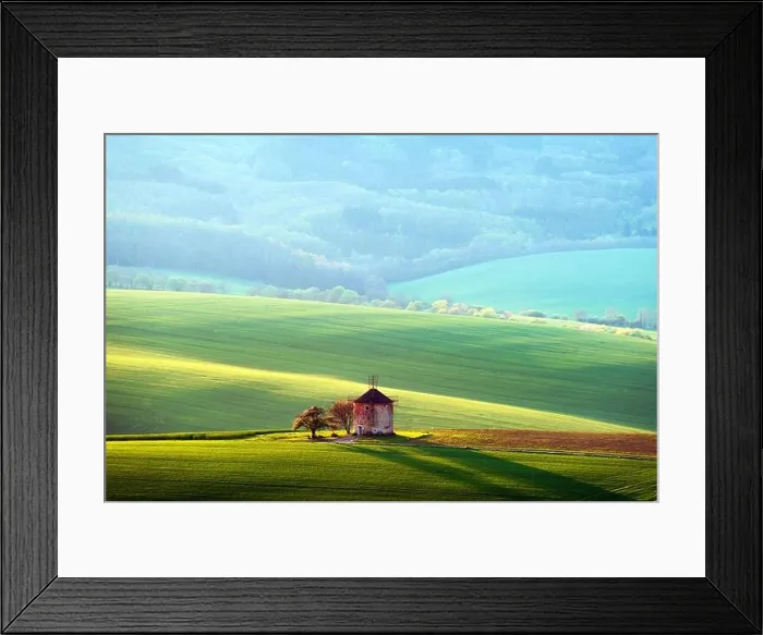 Framed Print : Picturesque rural landscape with old windmill and green sunny spring hills. South Moravia region, Czech Republic Framed Print : Picturesque rural landscape with old windmill and green sunny spring hills. South Moravia region, Czech Republic