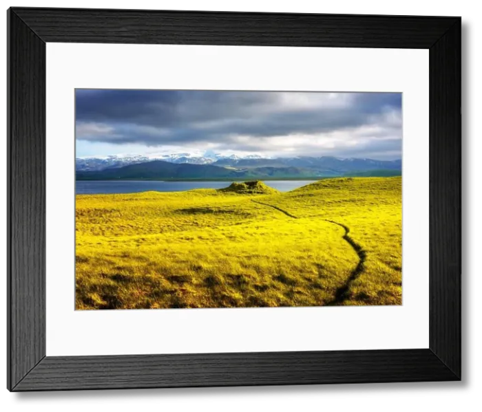 Framed Print : Gorgeous Iceland landscape with green grass field, blue lake and snow-capped mountains in the background. Iceland, Europe