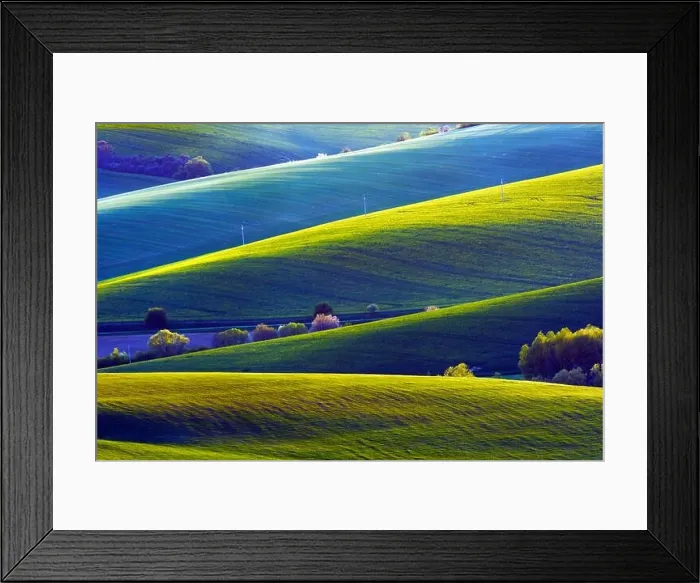 Framed Print : Picturesque rural landscape with green agricultural fields and trees on spring hills. South Moravia region, Czech Republic Framed Print : Picturesque rural landscape with green agricultural fields and trees on spring hills. South Moravia region, Czech Republic