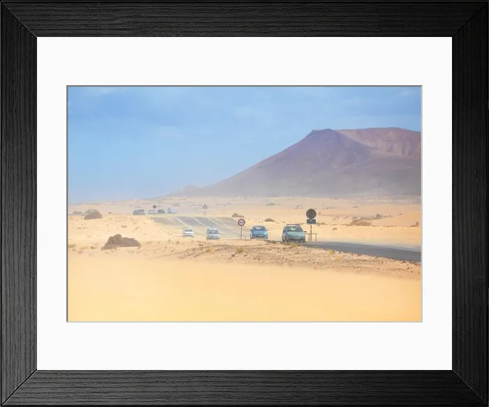 Framed Print : Fuerteventura Island, dust storm in Parque Natural de Corralejo, in the background volcano Roja, Spain, Canary Islands Framed Print : Fuerteventura Island, dust storm in Parque Natural de Corralejo, in the background volcano Roja, Spain, Canary Islands