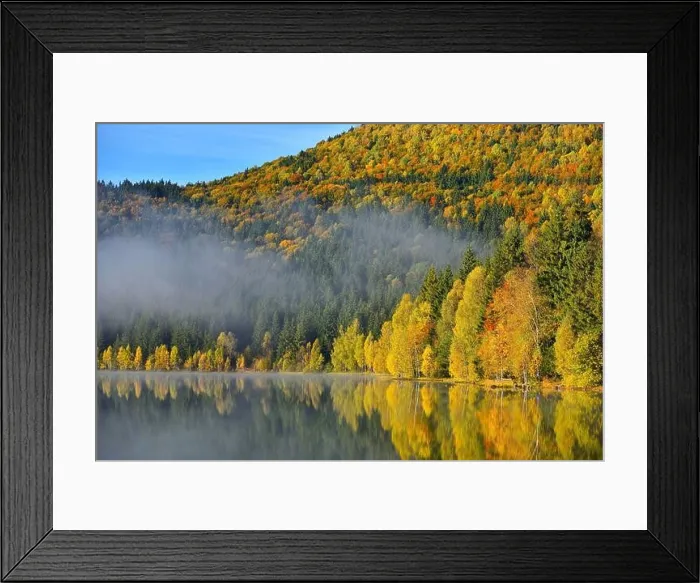Framed Print : Autumn landscape in the mountains with trees reflecting in the water at St. Ana's lake, Romania Framed Print : Autumn landscape in the mountains with trees reflecting in the water at St. Ana's lake, Romania