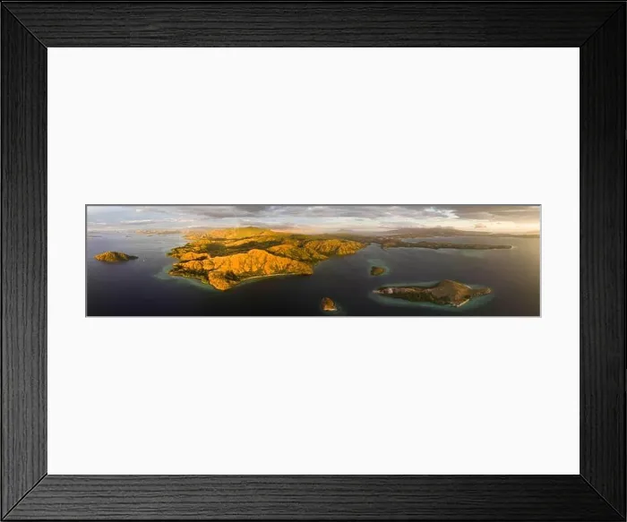 Framed Print : Evening light illuminates Rinca Island in Komodo National Park, Indonesia. In close proximity to Komodo Island, Rinca is home to many Komodo dragons Framed Print : Evening light illuminates Rinca Island in Komodo National Park, Indonesia. In close proximity to Komodo Island, Rinca is home to many Komodo dragons