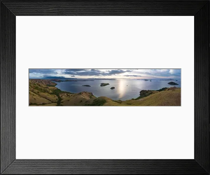 Framed Print : Evening light illuminates Rinca Island in Komodo National Park, Indonesia. In close proximity to Komodo Island, Rinca is home to many Komodo dragons Framed Print : Evening light illuminates Rinca Island in Komodo National Park, Indonesia. In close proximity to Komodo Island, Rinca is home to many Komodo dragons
