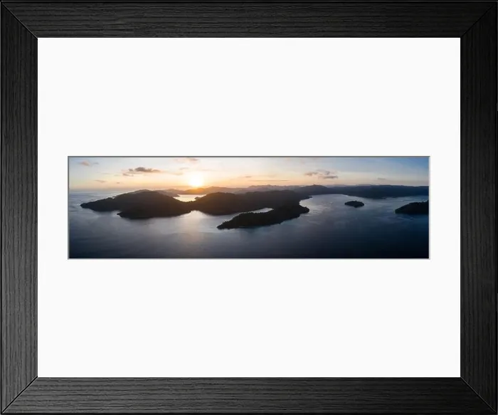 Framed Print : Dawn illuminates remote islands and the surrounding calm waters in Raja Ampat, Indonesia. This region is the epicenter of marine biodiversity Framed Print : Dawn illuminates remote islands and the surrounding calm waters in Raja Ampat, Indonesia. This region is the epicenter of marine biodiversity