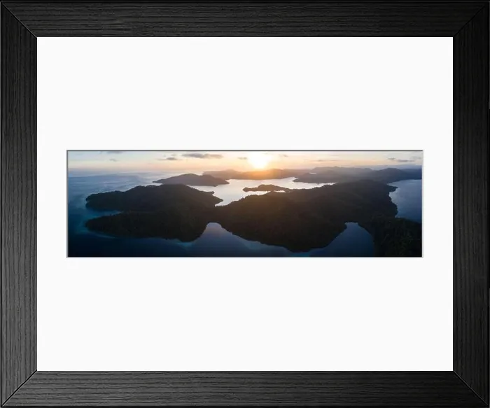Framed Print : Dawn illuminates remote islands and the surrounding calm waters in Raja Ampat, Indonesia. This region is the epicenter of marine biodiversity Framed Print : Dawn illuminates remote islands and the surrounding calm waters in Raja Ampat, Indonesia. This region is the epicenter of marine biodiversity