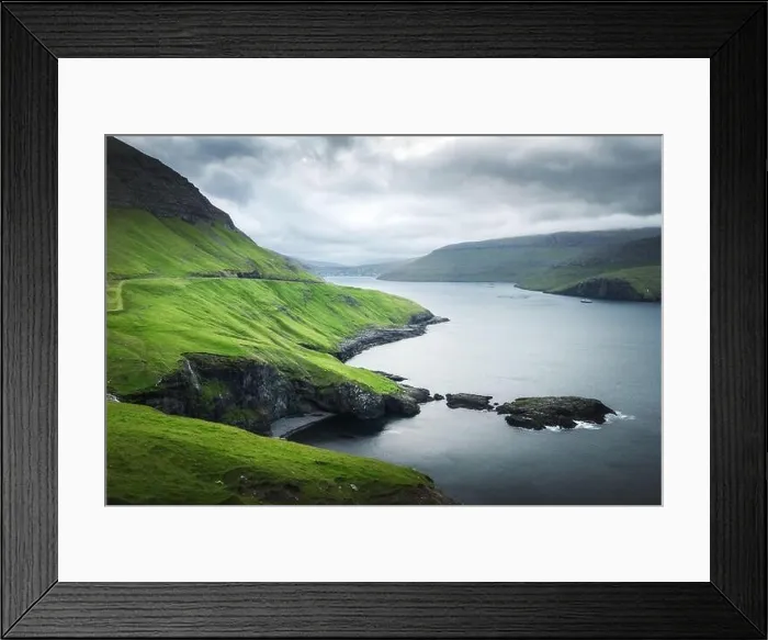 Framed Print : Dramatic view of green hills of Vagar island and Sorvagur town on background. Faroe islands, Denmark. Landscape photography