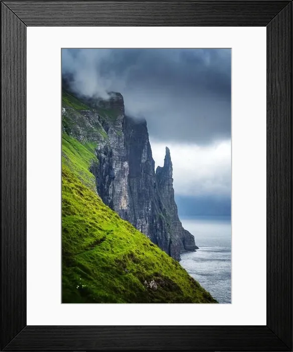 Framed Print : Gorgeous faroese landscape with famous Witches Finger cliffs and dramatic cloudy sky from Trollkonufingur viewpoint Framed Print : Gorgeous faroese landscape with famous Witches Finger cliffs and dramatic cloudy sky from Trollkonufingur viewpoint