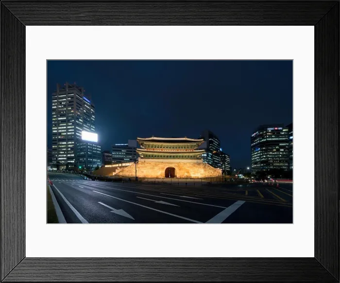 Framed Print : Namdaemun gate in Seoul business district area skyline view from street at night in Seoul, South Korea. Asian tourism, modern city life, or business f