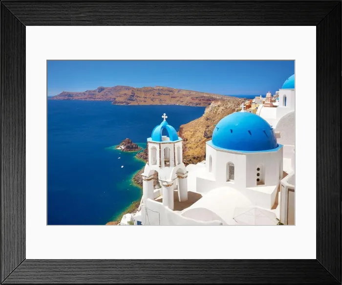 Framed Print : Santorini landscape with greek bell tower and white church with blue dome overlooking the sea, Oia, Santorini Island, Greece