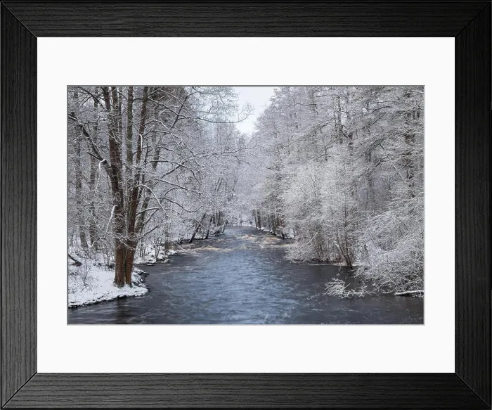 Framed Print : Scenic winter landscape with flowing river and morning light in Finland. Snowy trees Framed Print : Scenic winter landscape with flowing river and morning light in Finland. Snowy trees