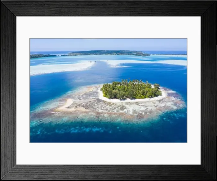 Framed Print : A remote island is found amid the serene seascape in Raja Ampat, Indonesia. This tropical region is a large part of the Coral Triangle Framed Print : A remote island is found amid the serene seascape in Raja Ampat, Indonesia. This tropical region is a large part of the Coral Triangle