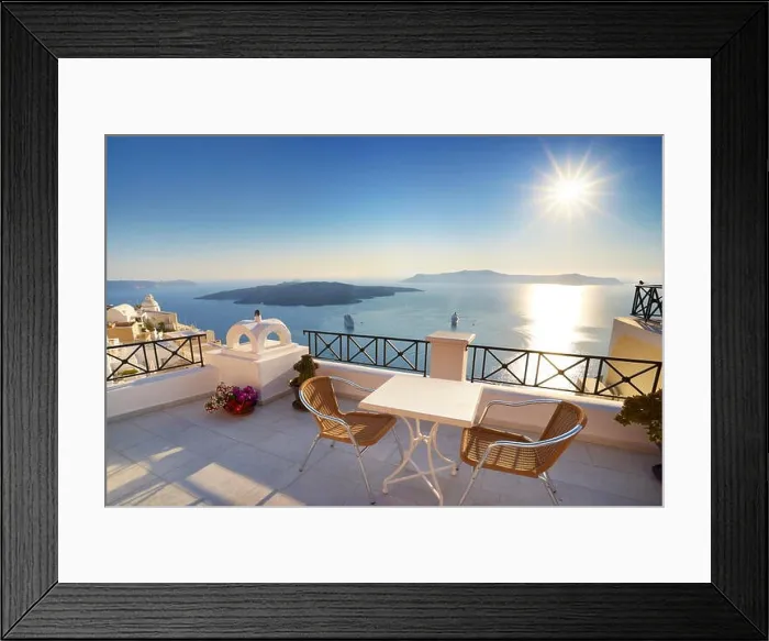 Framed Print : Thira (capital city of Santorini) - terrace with a background view to the sea and sun on the sky, Santorini Island, Greece Framed Print : Thira (capital city of Santorini) - terrace with a background view to the sea and sun on the sky, Santorini Island, Greece