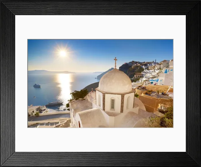 Framed Print : Thira (capital city of Santorini) - greek white church overlooking the sea and sun on blue sky, Santorini Island, Greece Framed Print : Thira (capital city of Santorini) - greek white church overlooking the sea and sun on blue sky, Santorini Island, Greece