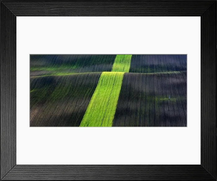 Framed Print : Rural spring landscape with colored striped hills. Green and brown waves of the agricultural fields of South Moravia, Czech Republic Framed Print : Rural spring landscape with colored striped hills. Green and brown waves of the agricultural fields of South Moravia, Czech Republic