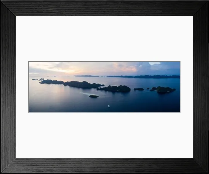 Framed Print : Limestone islands are surrounded by healthy coral reefs in Raja Ampat, Indonesia. This region is thought to be the center of marine biodiversity Framed Print : Limestone islands are surrounded by healthy coral reefs in Raja Ampat, Indonesia. This region is thought to be the center of marine biodiversity