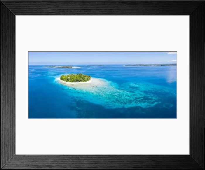 Framed Print : An idyllic tropical island is surrounded by reef in the Halmahera Sea, Indonesia. This remote region is part of the heart of the Coral Triangle Framed Print : An idyllic tropical island is surrounded by reef in the Halmahera Sea, Indonesia. This remote region is part of the heart of the Coral Triangle