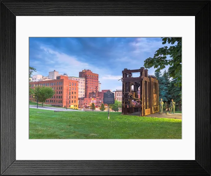 Framed Print : YOUNGSTOWN, OHIO - AUGUST 7, 2019: Downtown Youngstown with the Little Steel Strike of 1937 monument and memorial at twilight Framed Print : YOUNGSTOWN, OHIO - AUGUST 7, 2019: Downtown Youngstown with the Little Steel Strike of 1937 monument and memorial at twilight