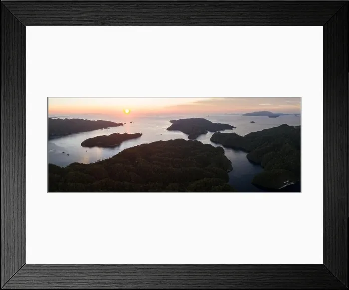 Framed Print : Sunset illuminates the sky over Alyui Bay, Waigeo, Raja Ampat. This beautiful body of water harbors extraordinary marine biodiversity Framed Print : Sunset illuminates the sky over Alyui Bay, Waigeo, Raja Ampat. This beautiful body of water harbors extraordinary marine biodiversity