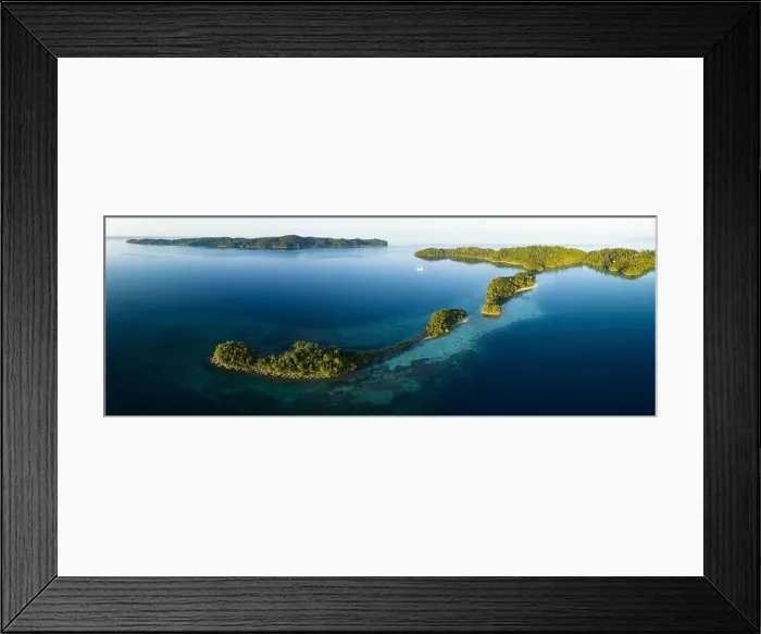 Framed Print : Healthy fringing coral reefs grow around the beautiful islands that rise from West Papua's seascape. This area harbors high marine biodiversity Framed Print : Healthy fringing coral reefs grow around the beautiful islands that rise from West Papua's seascape. This area harbors high marine biodiversity
