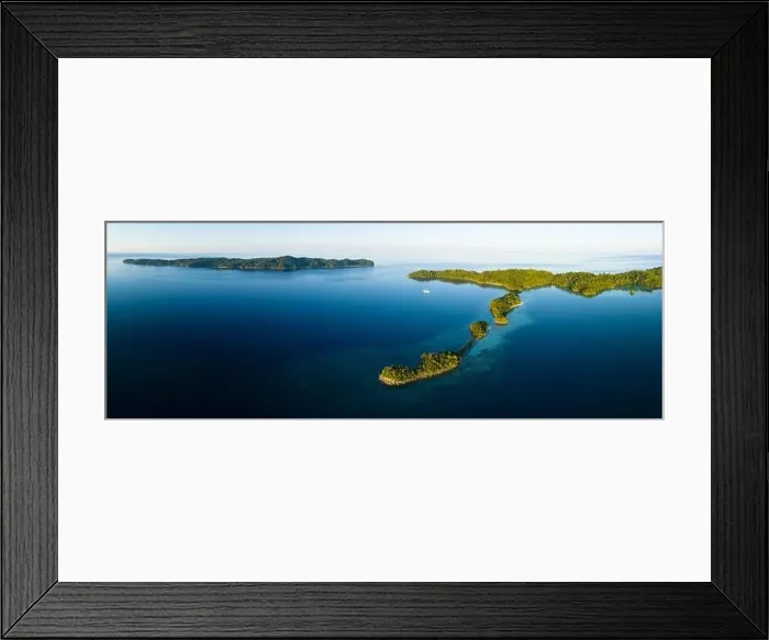 Framed Print : Healthy fringing coral reefs grow around the beautiful islands that rise from West Papua's seascape. This area harbors high marine biodiversity Framed Print : Healthy fringing coral reefs grow around the beautiful islands that rise from West Papua's seascape. This area harbors high marine biodiversity
