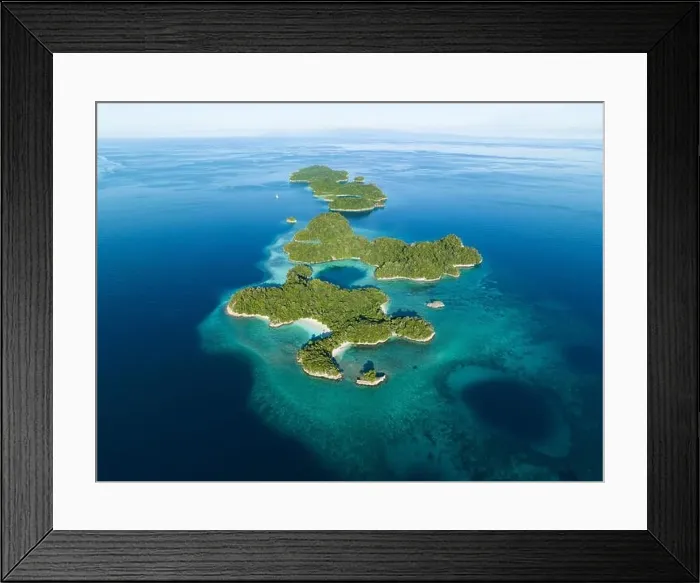 Framed Print : Healthy fringing coral reefs grow around the beautiful islands that rise from West Papua's seascape. This area is known for its high biodiversity Framed Print : Healthy fringing coral reefs grow around the beautiful islands that rise from West Papua's seascape. This area is known for its high biodiversity