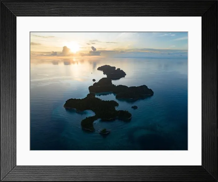 Framed Print : Coral reefs surround the rugged limestone islands that rise from West Papua's seascape. This remote part of Indonesia has high marine biodiversity Framed Print : Coral reefs surround the rugged limestone islands that rise from West Papua's seascape. This remote part of Indonesia has high marine biodiversity