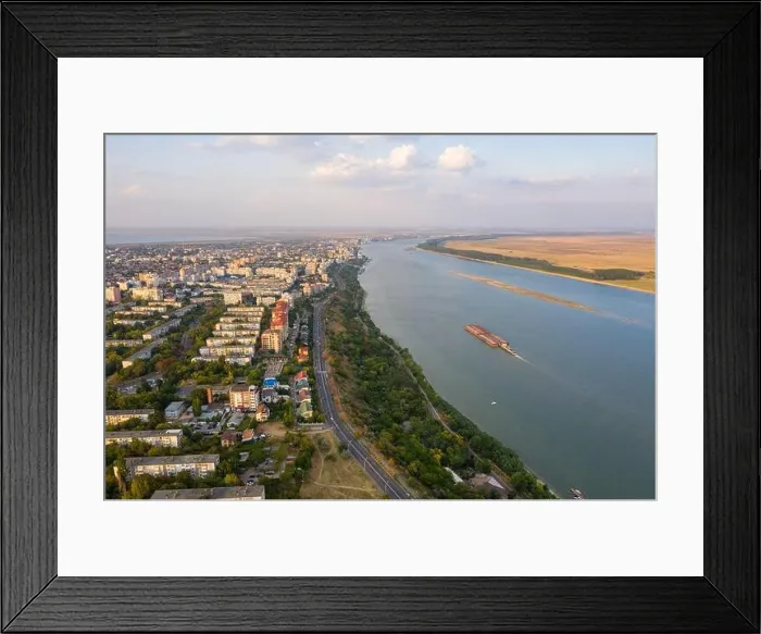Framed Print : Aerial view of Galati City, Romania. Danube River near city with sunset warm light Framed Print : Aerial view of Galati City, Romania. Danube River near city with sunset warm light