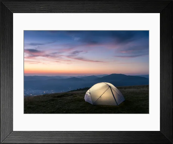Framed Print : Grey tent lighted from the inside by a flashlight against the backdrop of an incredible mountain landscape. Amazing evening highland. Tourism concept Framed Print : Grey tent lighted from the inside by a flashlight against the backdrop of an incredible mountain landscape. Amazing evening highland. Tourism concept