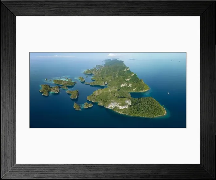 Framed Print : Biodiverse coral reefs surround the dramatic limestone islands that have been uplifted from Raja Ampat's beautiful, tropical seascape Framed Print : Biodiverse coral reefs surround the dramatic limestone islands that have been uplifted from Raja Ampat's beautiful, tropical seascape