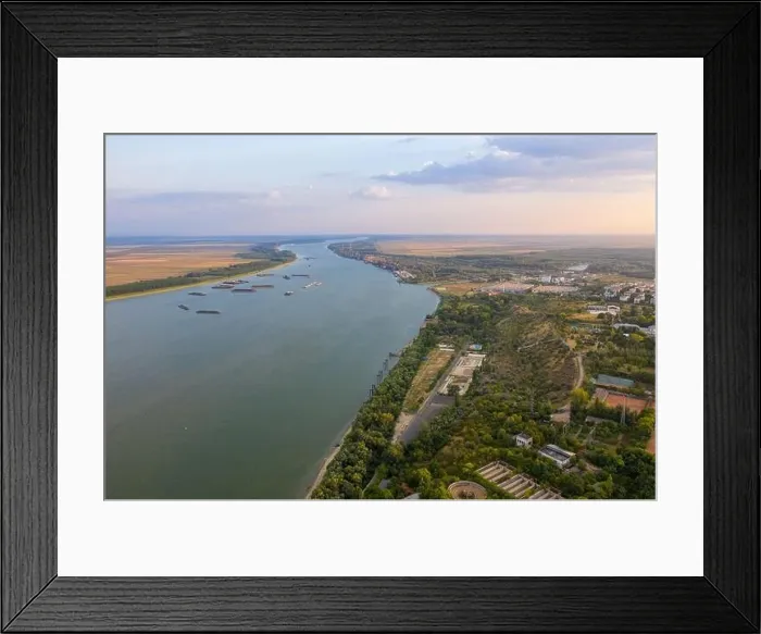 Framed Print : Aerial view of Galati City, Romania. Danube River near city with sunset warm light