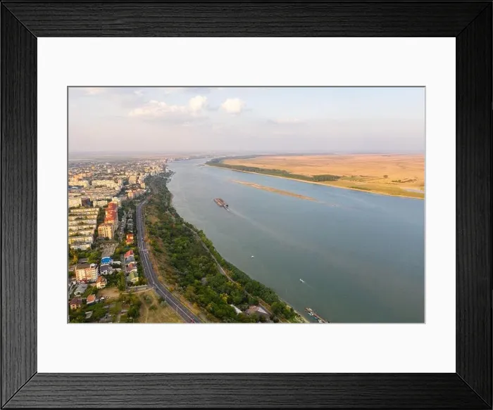 Framed Print : Aerial view of Galati City, Romania. Danube River near city with sunset warm light Framed Print : Aerial view of Galati City, Romania. Danube River near city with sunset warm light