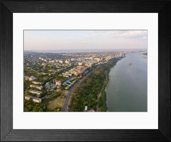Framed Print : Aerial view of Galati City, Romania. Danube River near city with sunset warm light Framed Print : Aerial view of Galati City, Romania. Danube River near city with sunset warm light