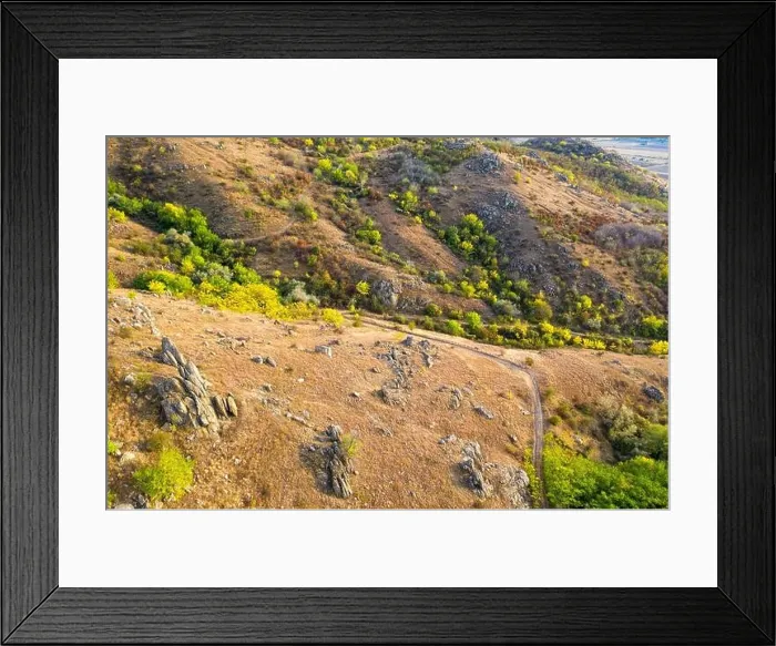Framed Print : Top view over mountain trail landscape. Aerial drone view Framed Print : Top view over mountain trail landscape. Aerial drone view