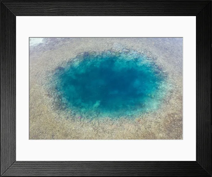 Framed Print : Blue holes are found amid a shallow reef flat on the island of Sebayor in Komodo National Park, Indonesia. These blue holes formed as sink holes Framed Print : Blue holes are found amid a shallow reef flat on the island of Sebayor in Komodo National Park, Indonesia. These blue holes formed as sink holes