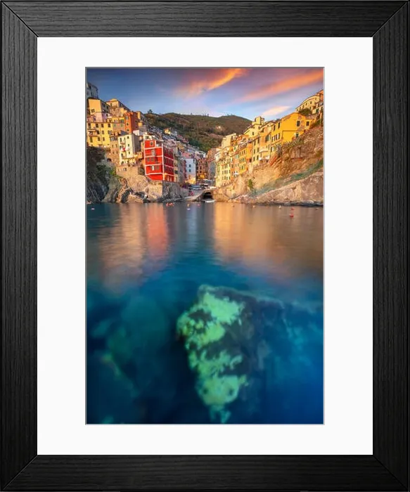 Framed Print : Riomaggiore, Italy. Cityscape image of Riomaggiore, Cinque Terre, Italy, during dramatic sunset Framed Print : Riomaggiore, Italy. Cityscape image of Riomaggiore, Cinque Terre, Italy, during dramatic sunset