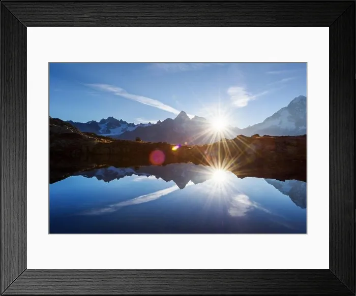 Framed Print : Sun rising on Chesery lake (Lac De Cheserys) in France Alps. Monte Bianco mountain range on background. Landscape photography, Chamonix Framed Print : Sun rising on Chesery lake (Lac De Cheserys) in France Alps. Monte Bianco mountain range on background. Landscape photography, Chamonix