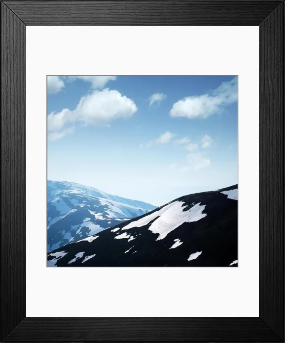 Framed Print : Spotted spring mountains with snow and grass on clear foggy sky background. Landscape photography Framed Print : Spotted spring mountains with snow and grass on clear foggy sky background. Landscape photography